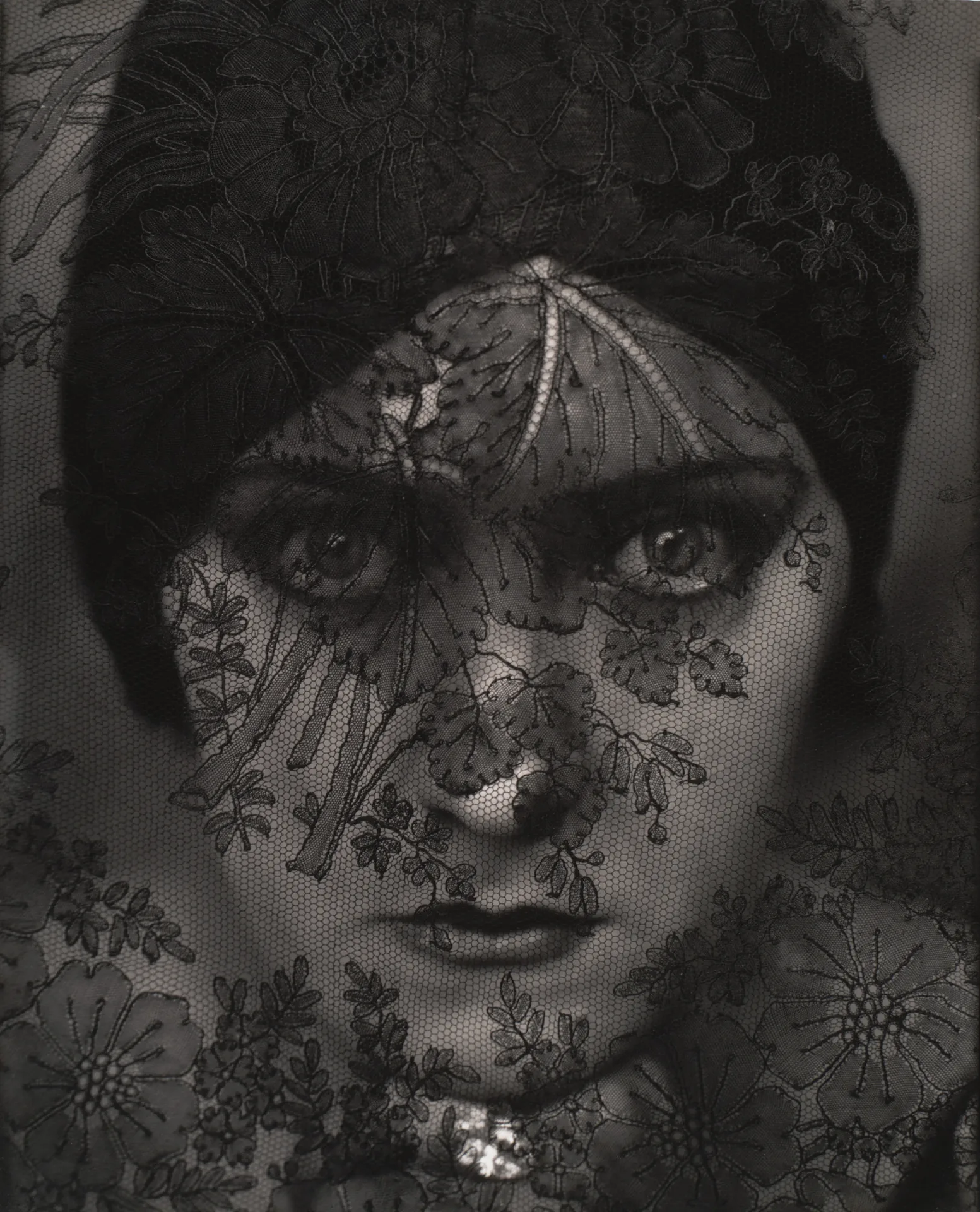 Edward Steichen, Gloria Swanson, 1924 — movie star photographed through lace veil, face emerging from darkness